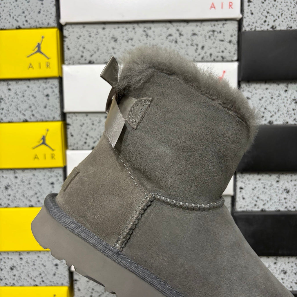 UGG Mini Bailey Bow Ankle Boot – Suede Boot with Tonal Grey Shearling Lining, Grey Satin Bow & Grey Lug Sole in Grey